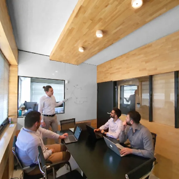 Developer teams working in the offices of the Dexon agency specialising in mobile and web application development
